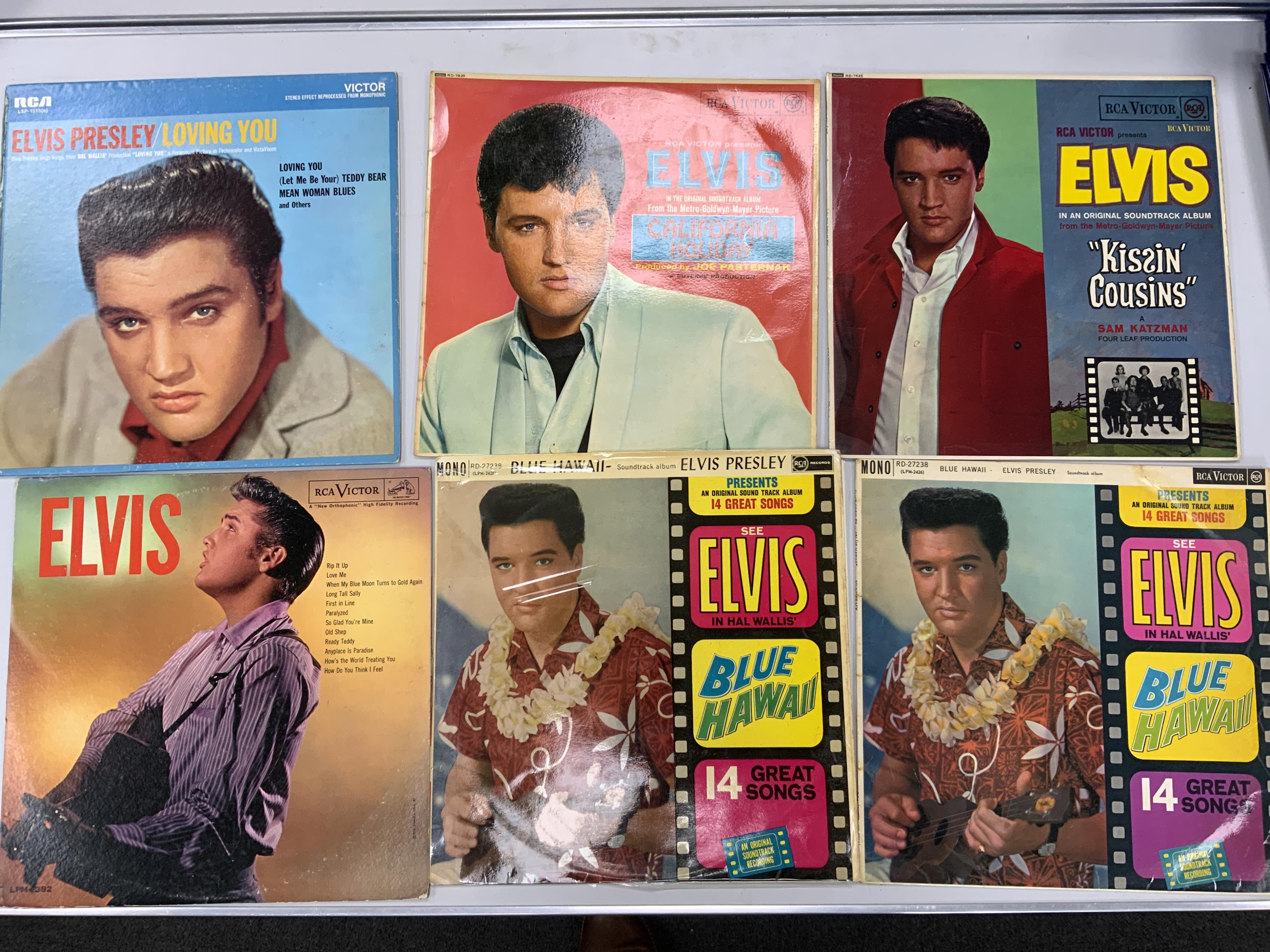 Sixteen Elvis Presley LP record albums including; It Happened at the World’s Fair, Paradise Hawaiian Style, Elvis’ Golden Records, Blue Hawaii, Loving You, California Holiday, Kissin’ Cousins, etc. Condition - fair to go